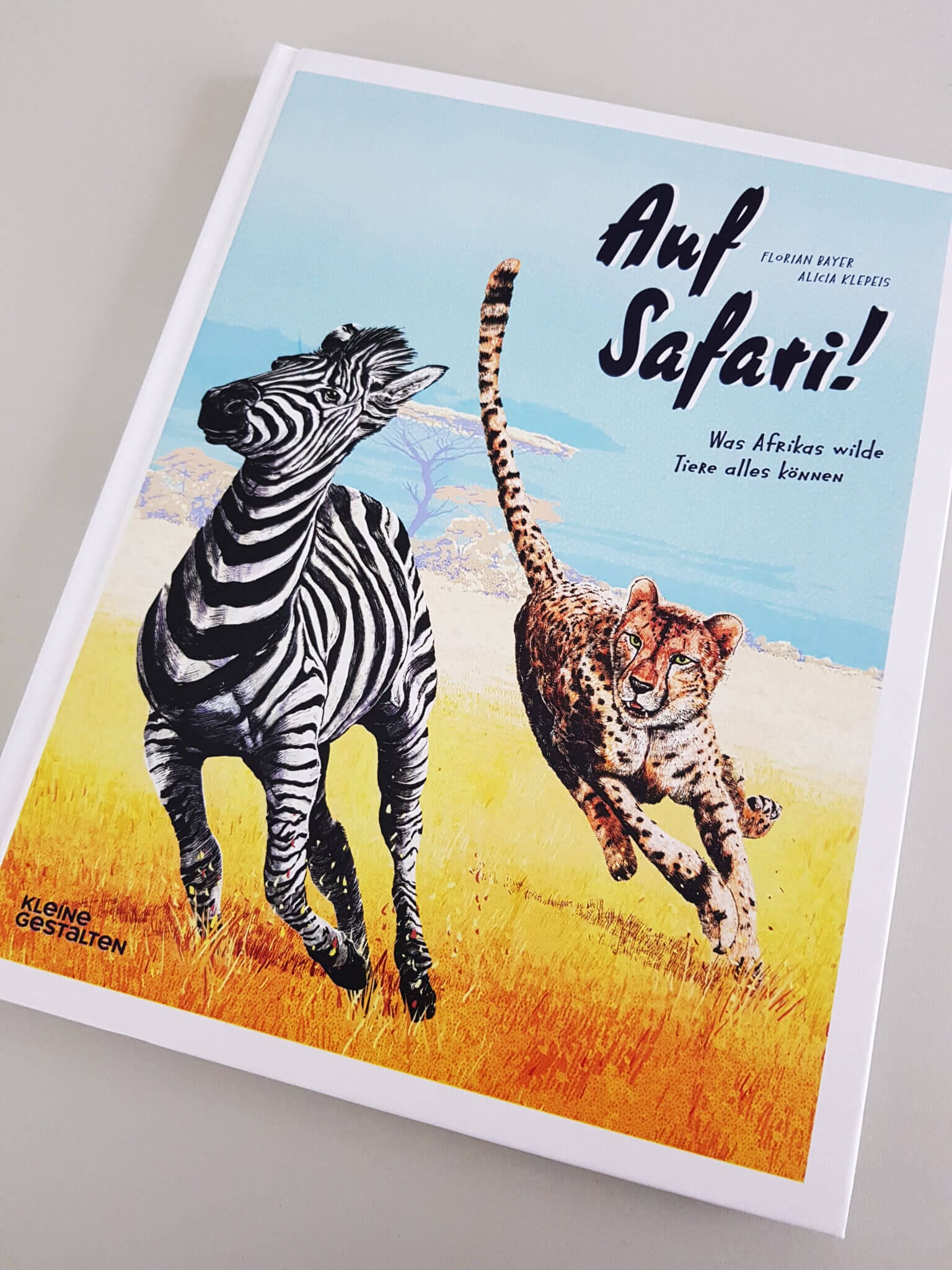 Auf Safari gestalten Verlag Buchcover liegend